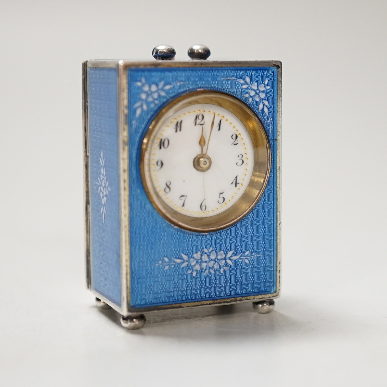 A 20th century Continental 935 standard blue enamelled white metal miniature timepiece, with mechanical movement, 4.5cm, lacks handle
